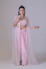 A pink organza cape and a crop blouse