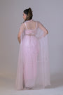 A pink organza cape and a crop blouse