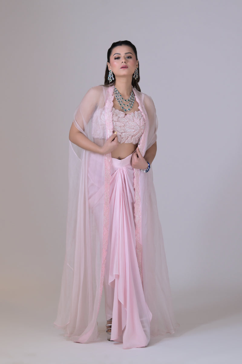 A pink organza cape and a crop blouse