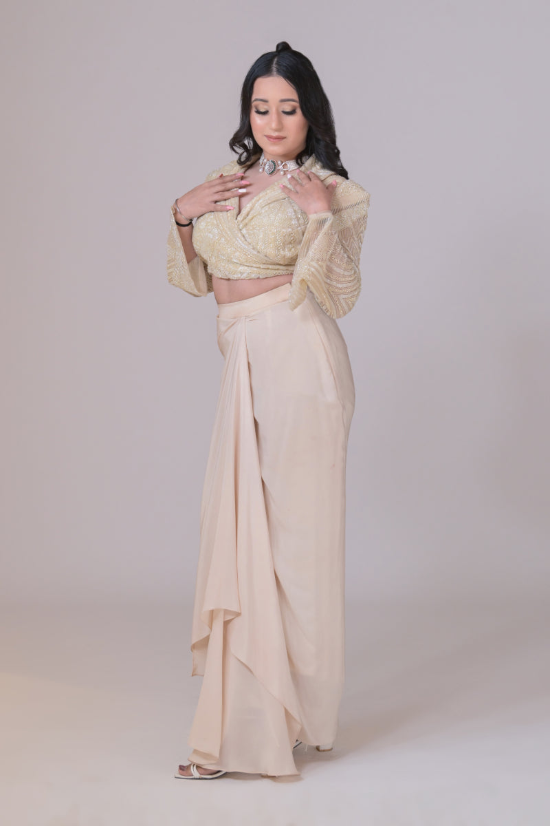 Ivory crop jacket with geometrical cutdana work and a crepe drape skirt