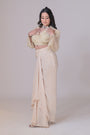 Ivory crop jacket with geometrical cutdana work and a crepe drape skirt