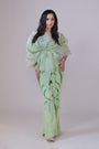 Light green hand embelished pants and an organza drape top