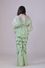 Light green hand embelished pants and an organza drape top