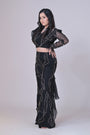 Black crop top with attached organza drape and embelished pants
