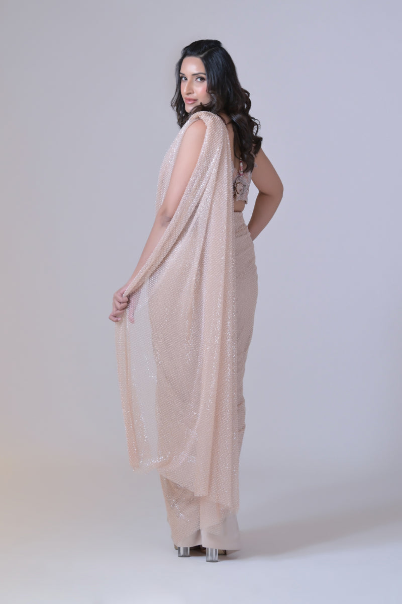 Beige crop top with cutdana palla work and lycra saree drape