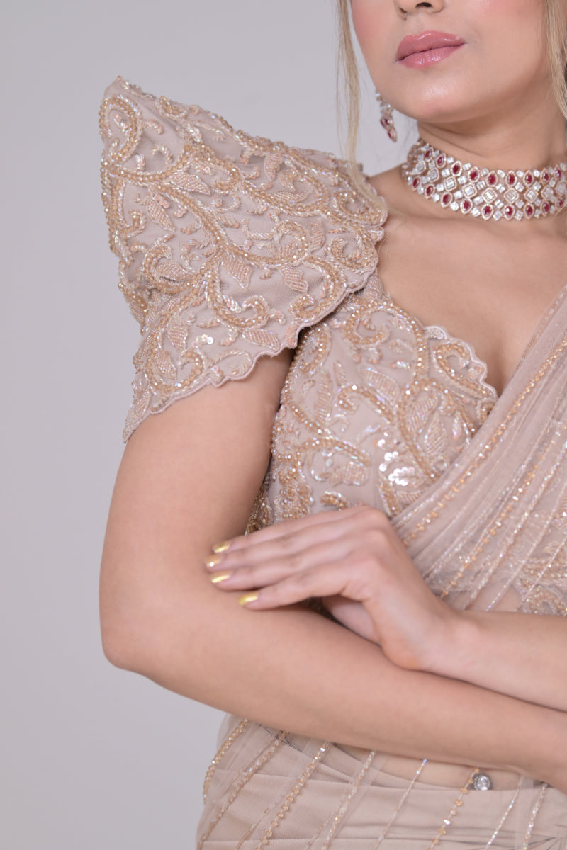Beige crop top with cutdana palla work and lycra saree drape