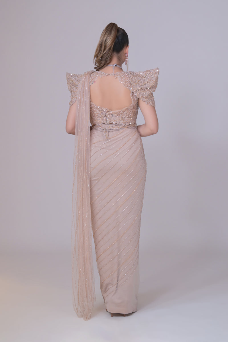 Beige crop top with cutdana palla work and lycra saree drape
