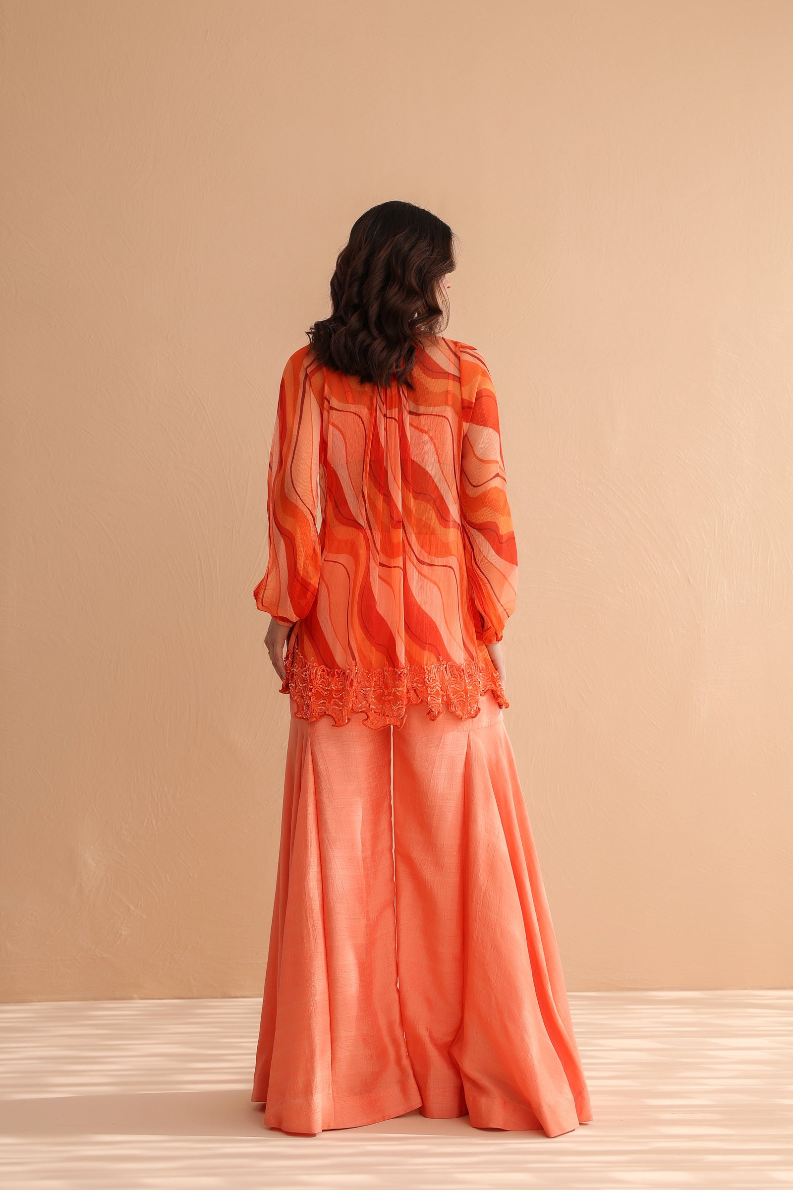 Tequila sunrise tunic with exaggerated bell-bottoms.