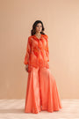 Tequila sunrise tunic with exaggerated bell-bottoms.
