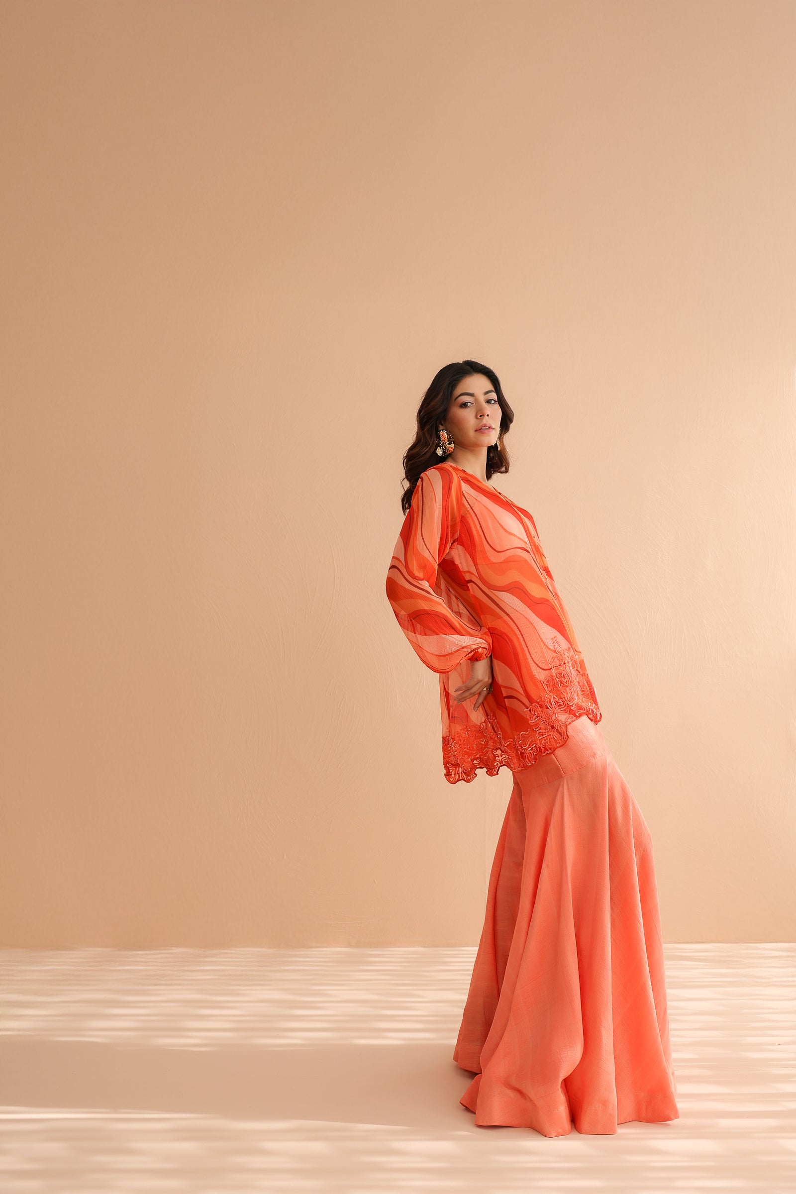 Tequila sunrise tunic with exaggerated bell-bottoms.