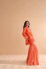 Tequila sunrise tunic with exaggerated bell-bottoms.