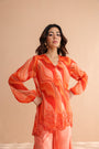 Tequila sunrise tunic with exaggerated bell-bottoms.