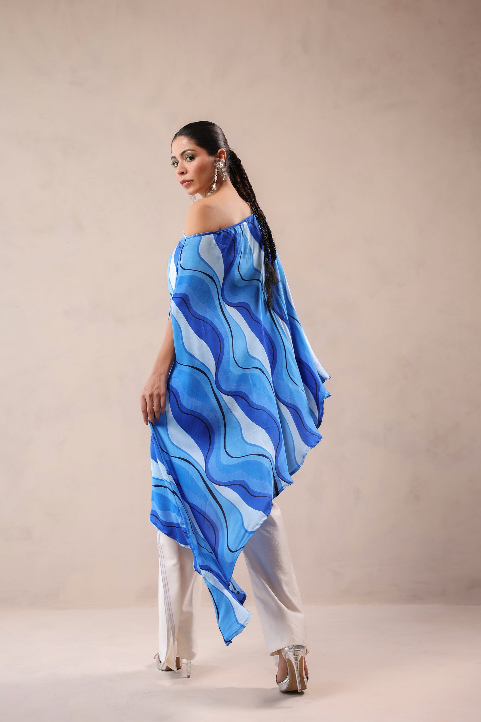Atlantic Blue cruise cape with creme fall pants.