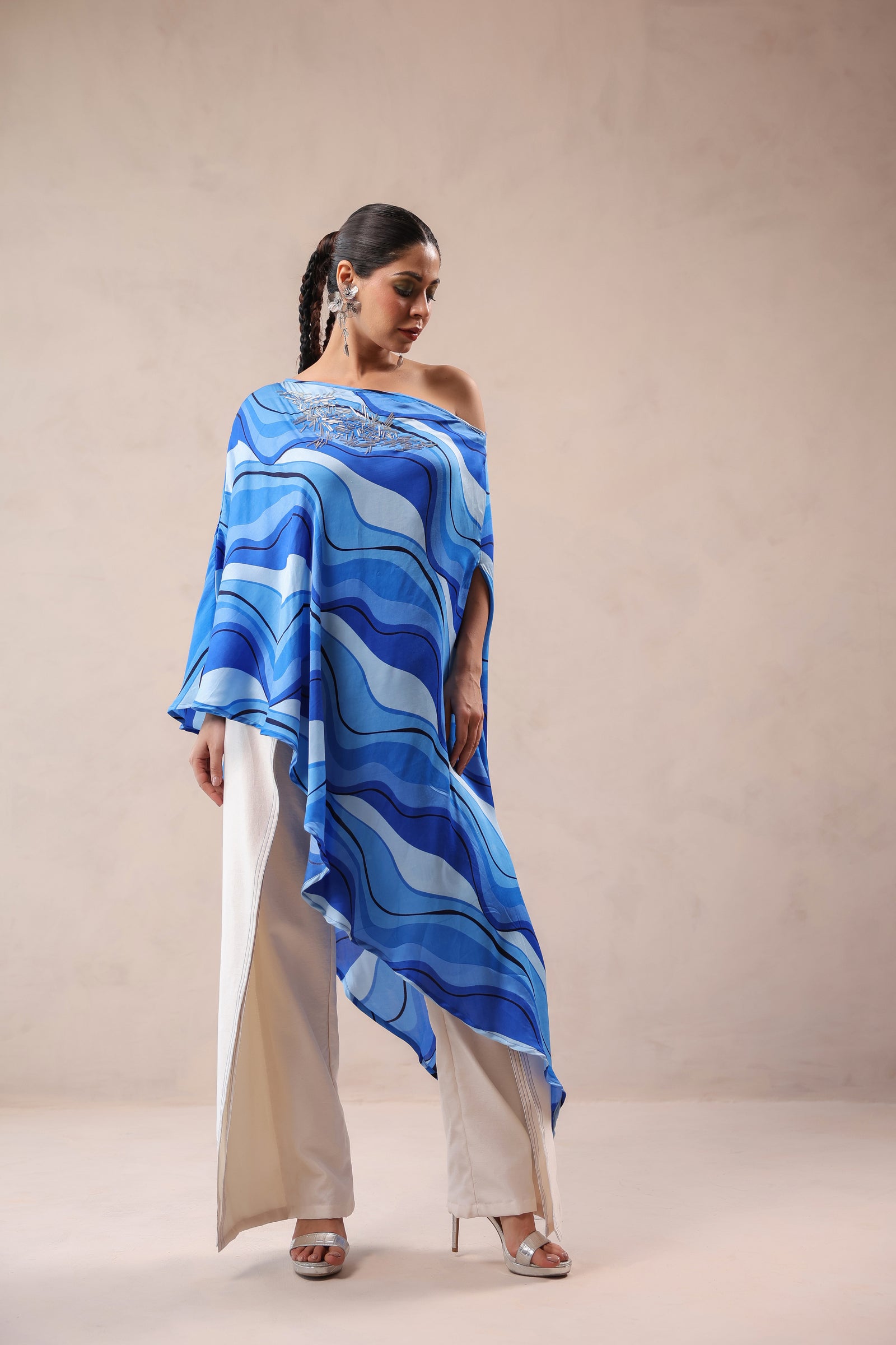 Atlantic Blue cruise cape with creme fall pants.