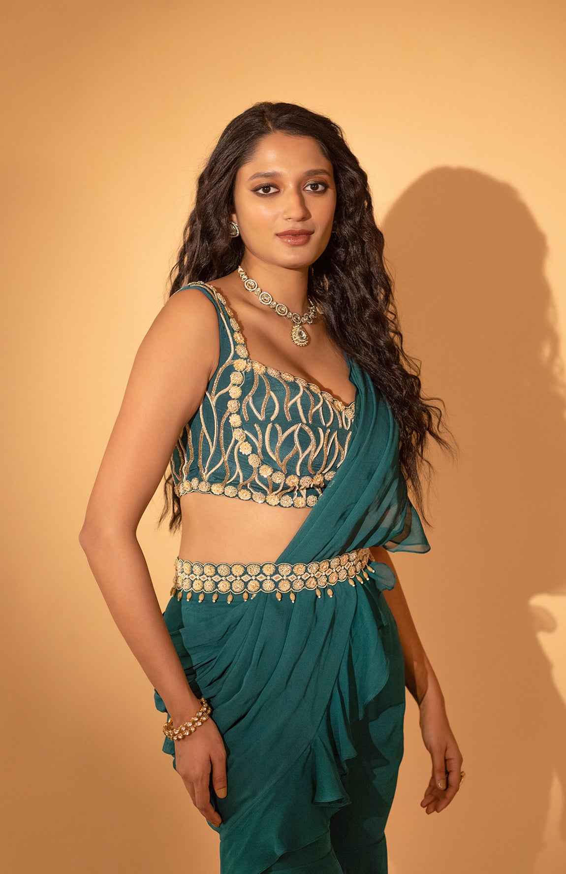 A Pre-Draped Saree Set Paired With Hand Embroidered Blouse And Belt