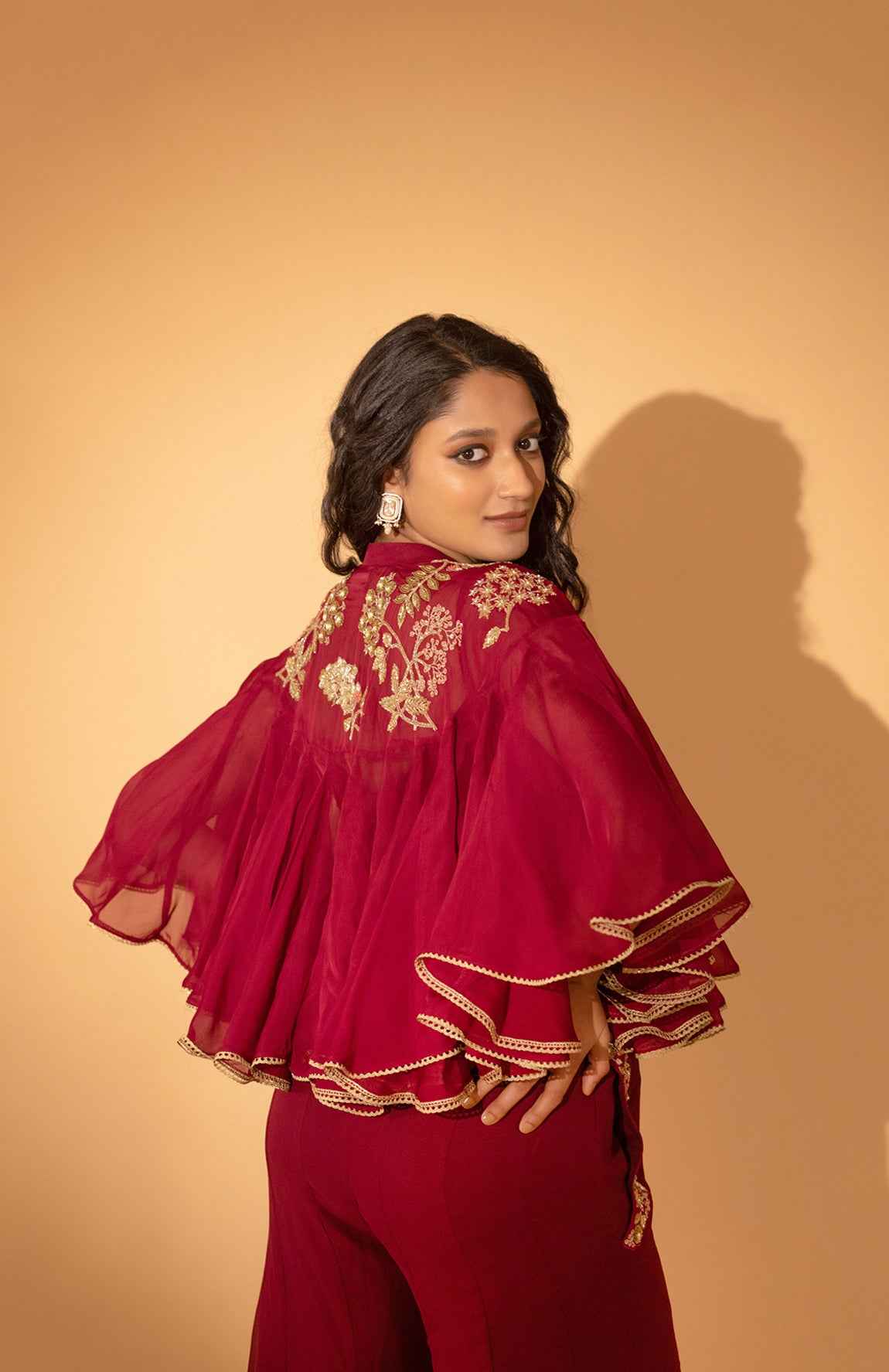 A Jumpsuit With Embroidered Cape