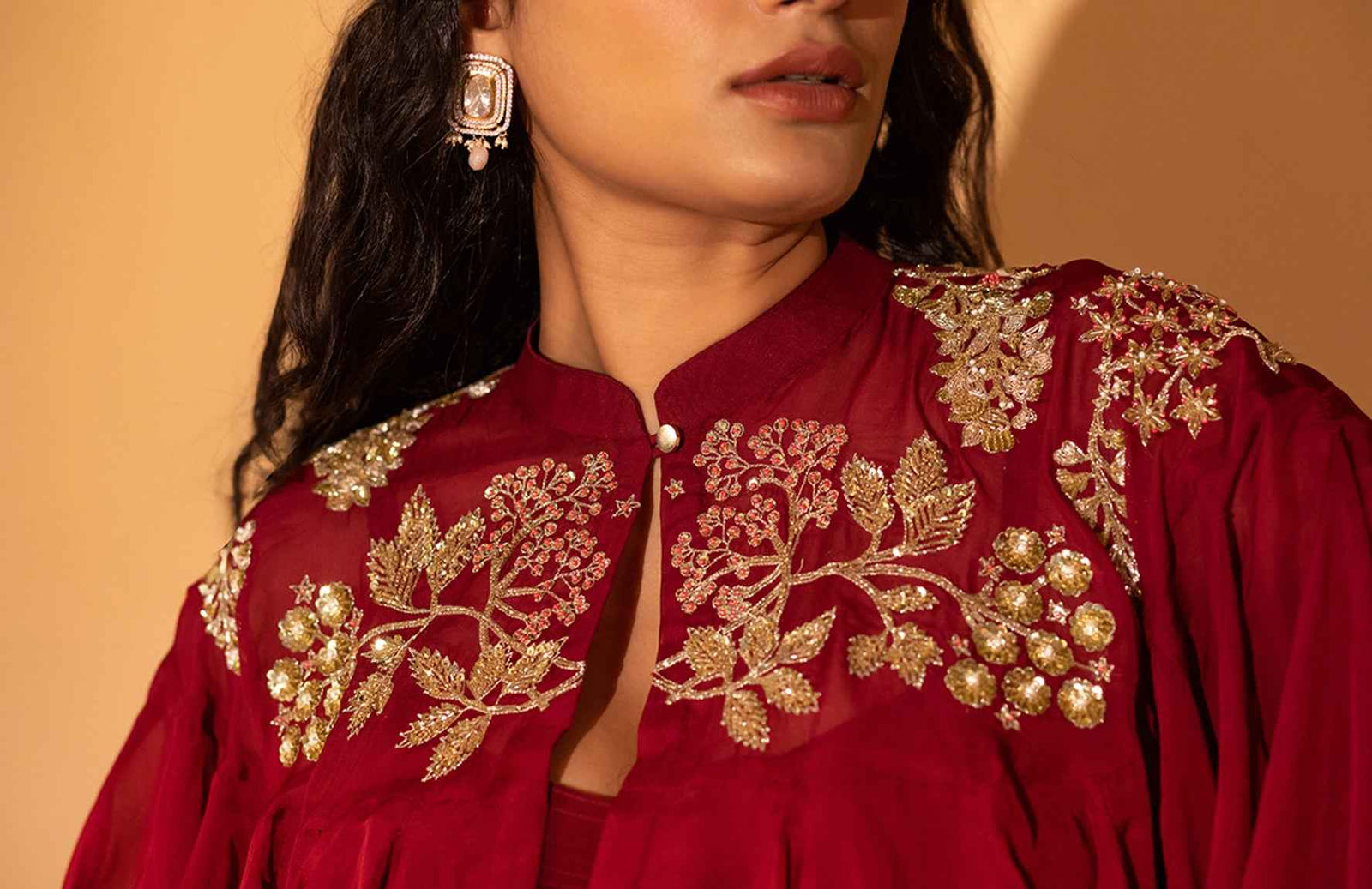 A Jumpsuit With Embroidered Cape