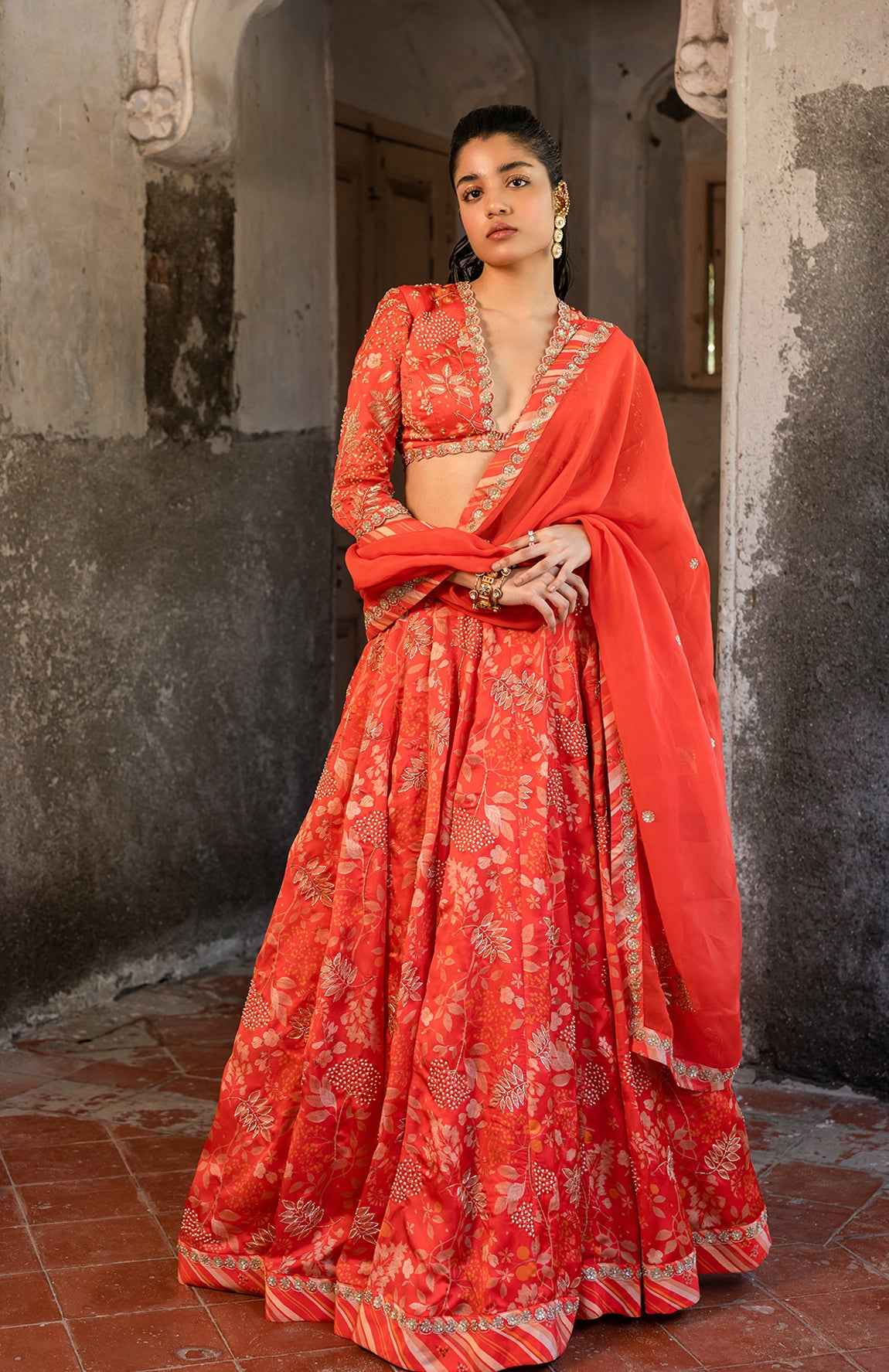 A Tommato Red Embroidered Lehenga With V Neck Blouse And Duptta