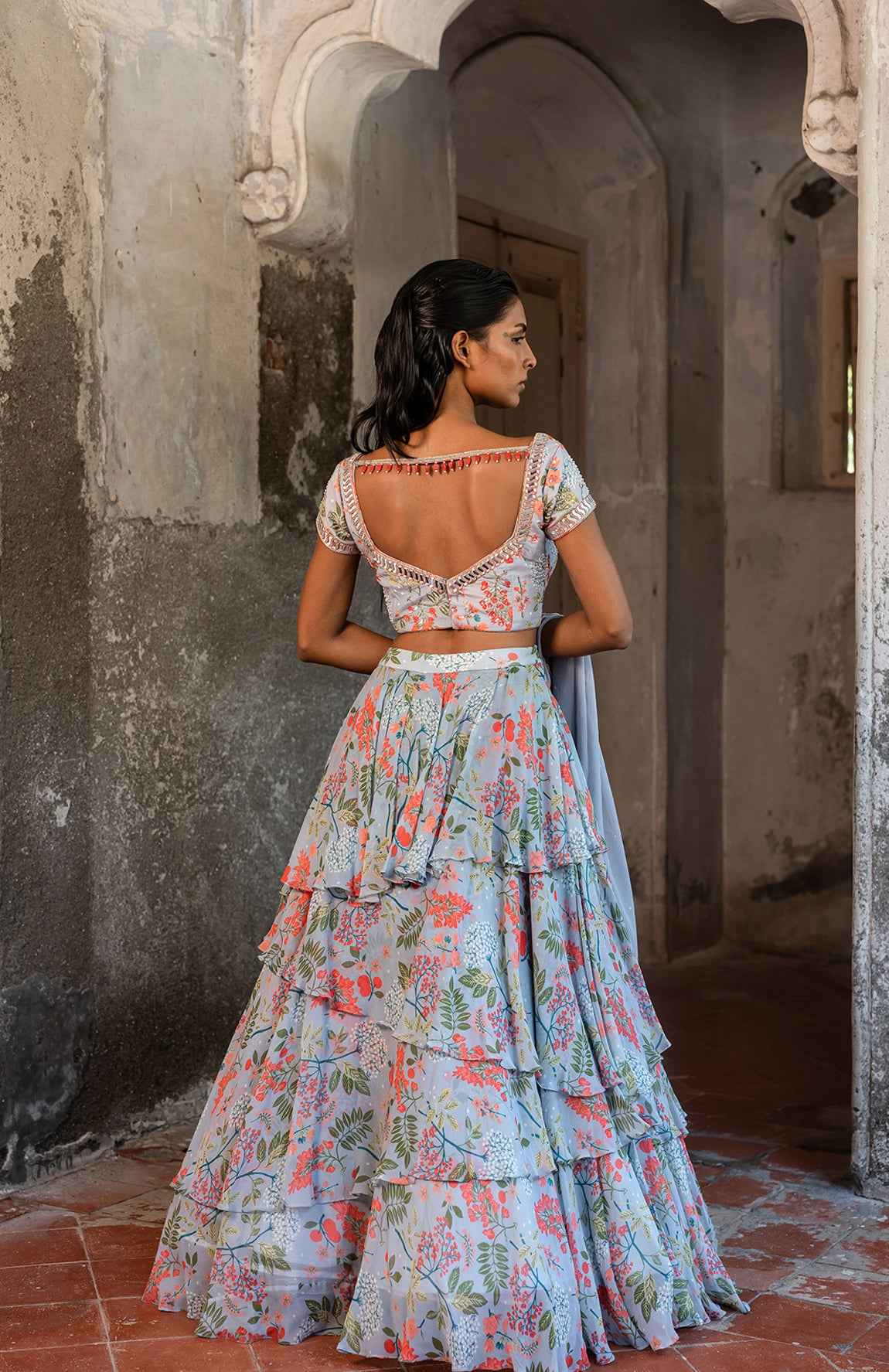A Printed Embroidered Layered Lehenga Set Paired With Blouse And Duptta