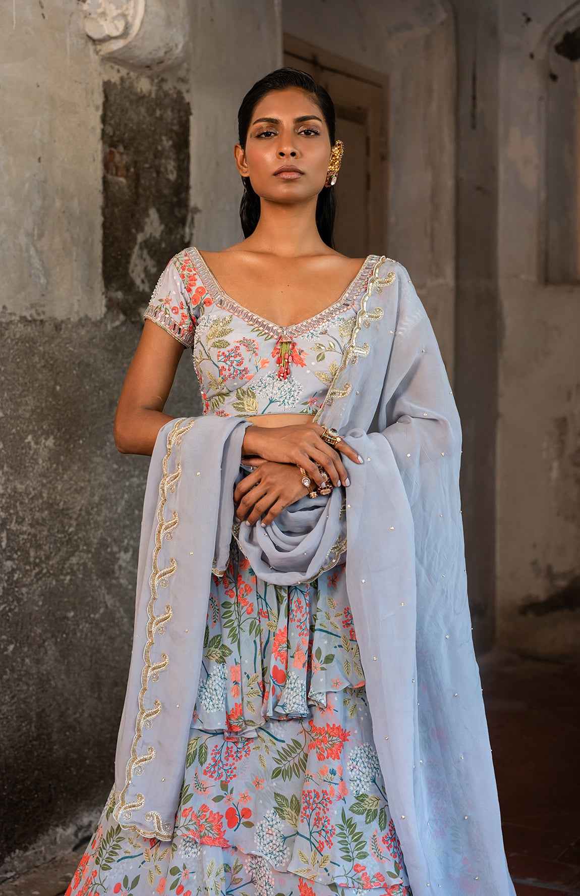 A Printed Embroidered Layered Lehenga Set Paired With Blouse And Duptta