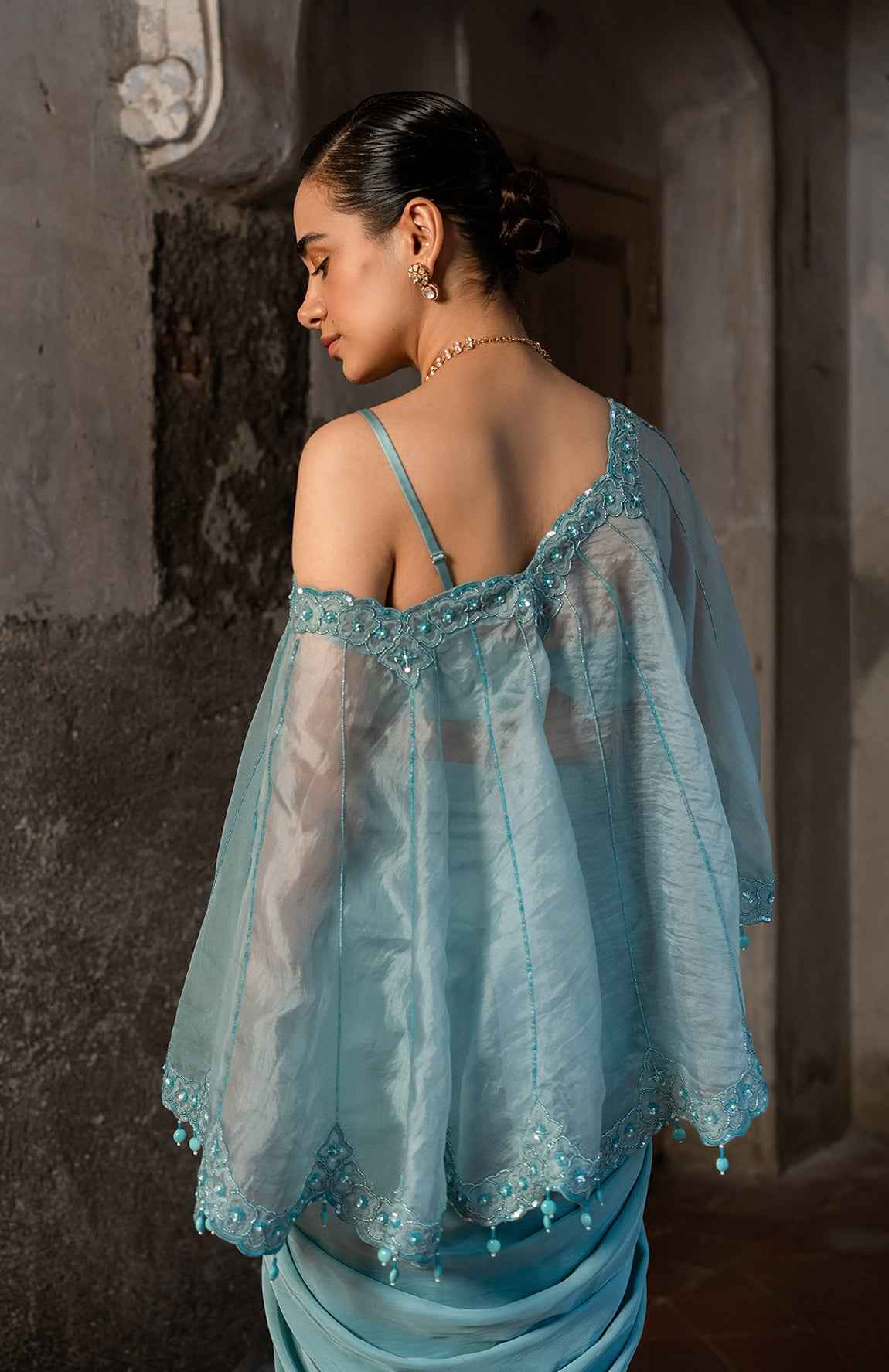 A Cape Set With Bustier And Draped Skirt