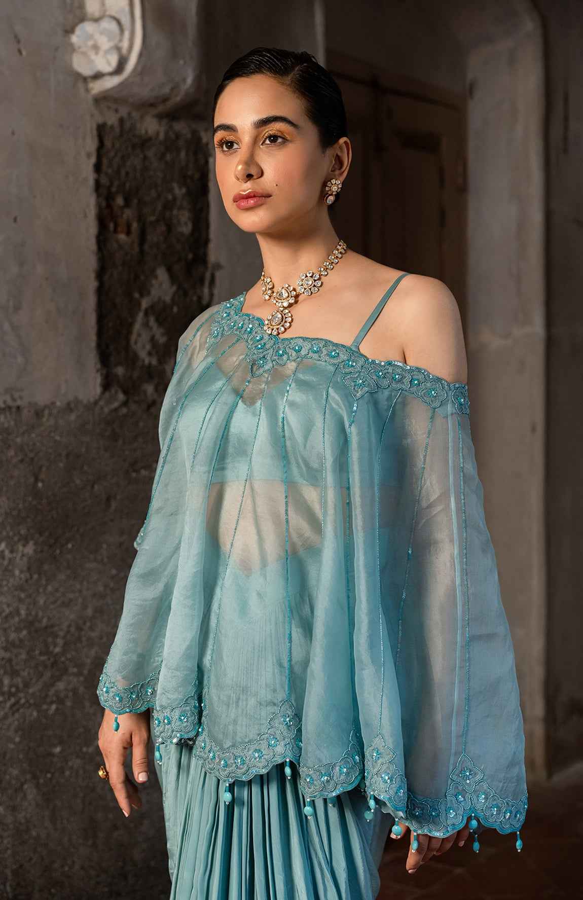 A Cape Set With Bustier And Draped Skirt