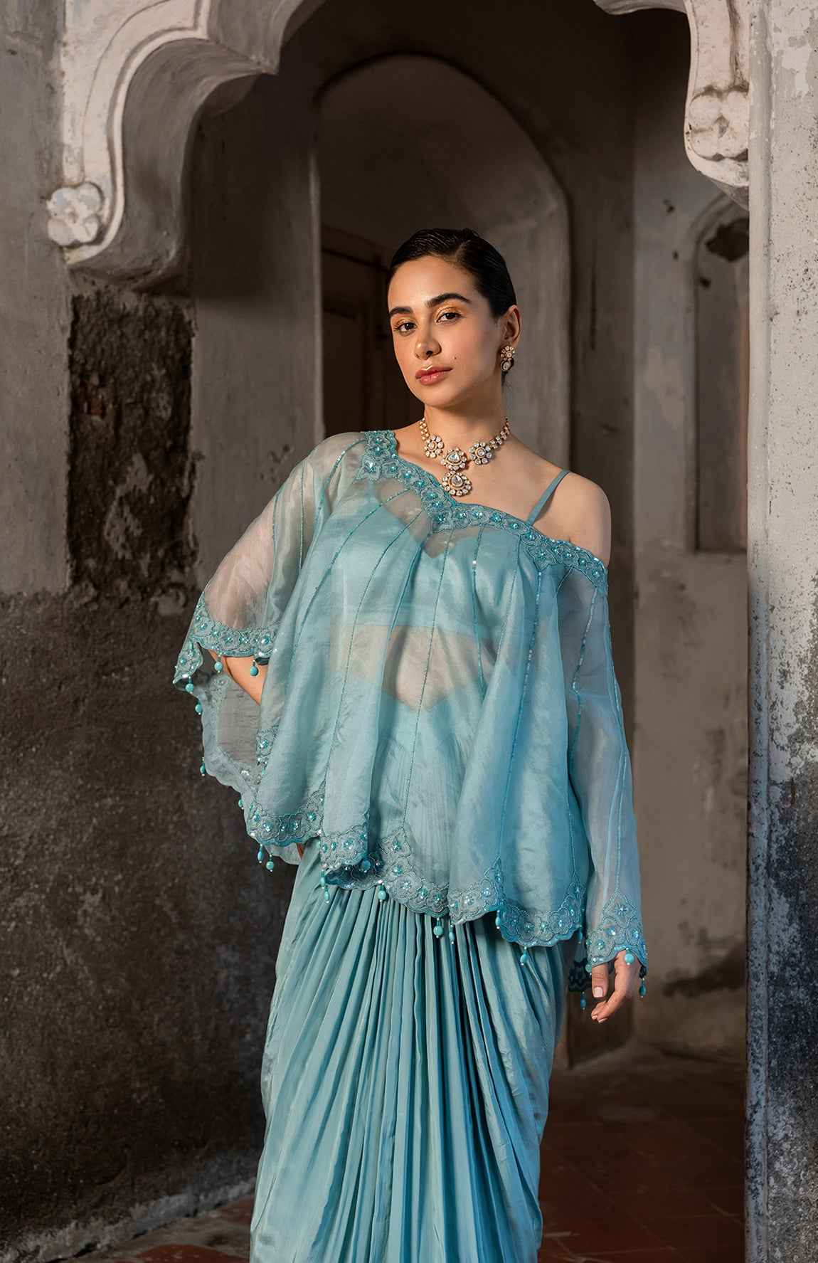 A Cape Set With Bustier And Draped Skirt