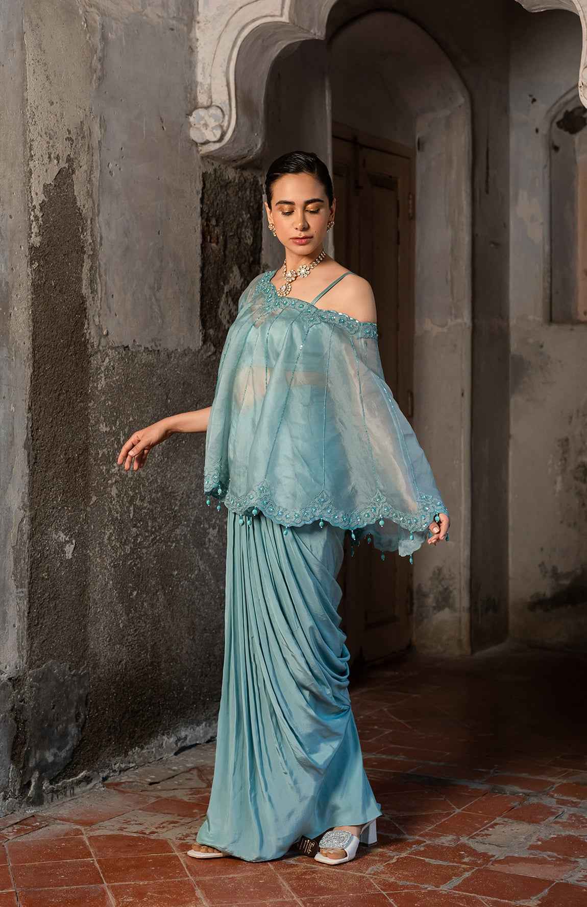 A Cape Set With Bustier And Draped Skirt