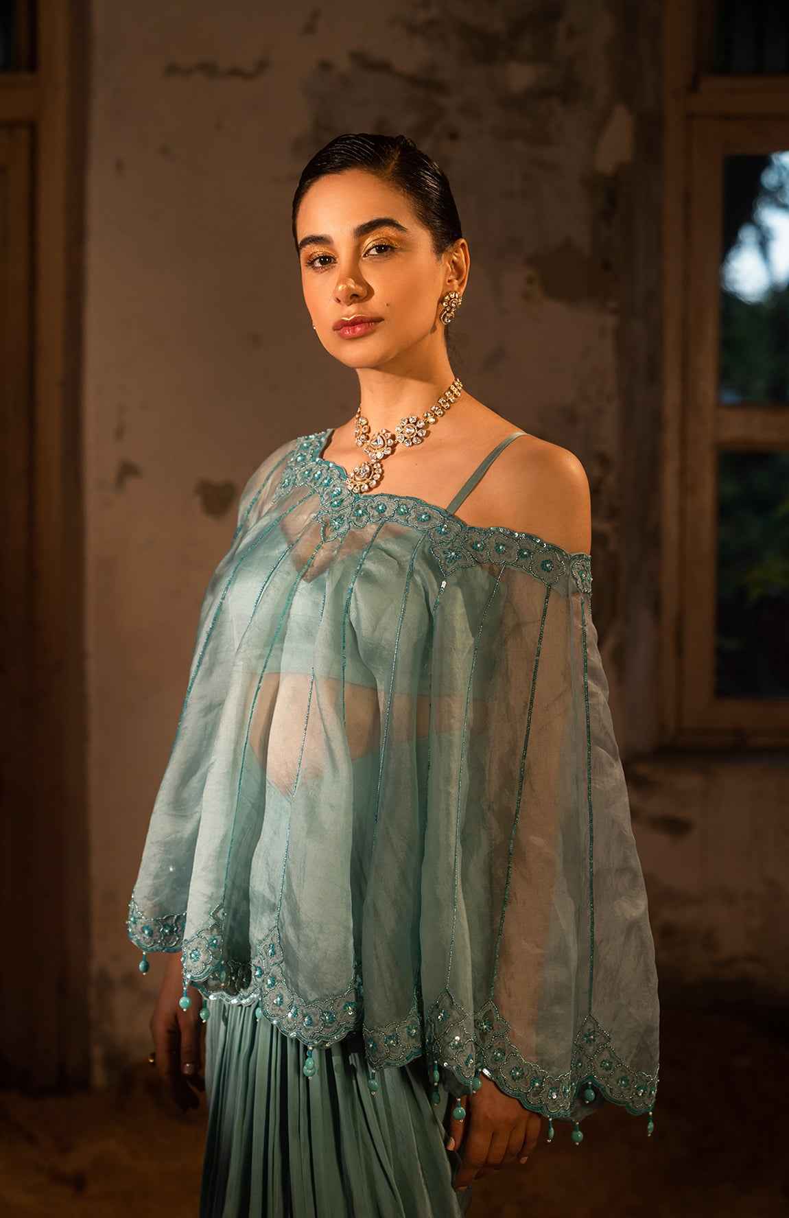 A Cape Set With Bustier And Draped Skirt