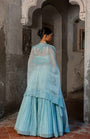 A Pwder Blue Lehenga With Maching Blouse And Cape