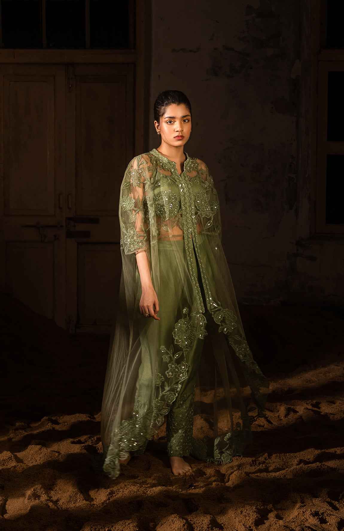 A Long Cape Paired With Bustier And Pants