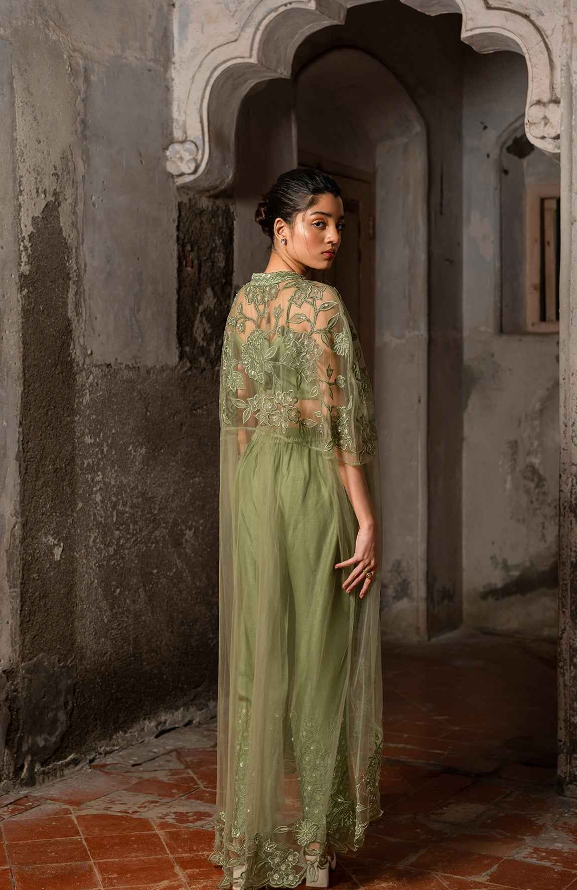 A Long Cape Paired With Bustier And Pants