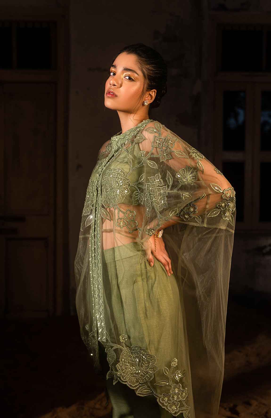 A Long Cape Paired With Bustier And Pants