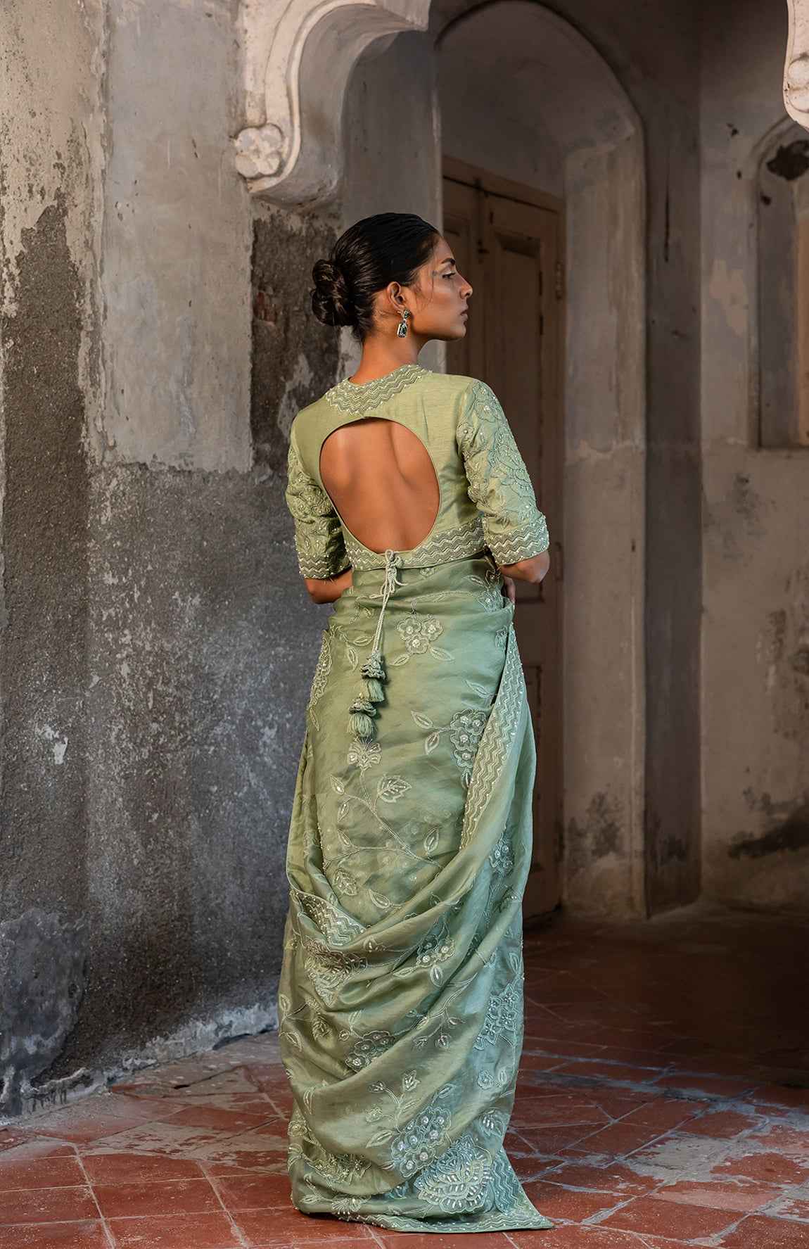 A Pista Green Embroidered Saree With High Neck Blouse