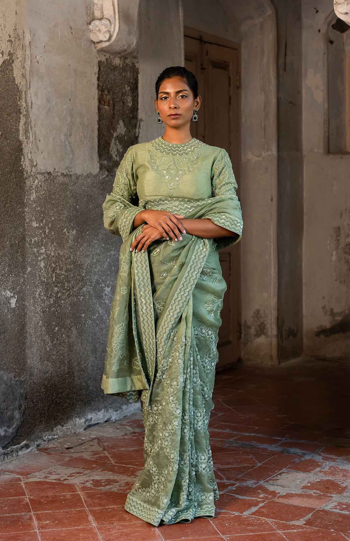 A Pista Green Embroidered Saree With High Neck Blouse
