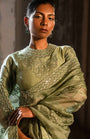 A Pista Green Embroidered Saree With High Neck Blouse