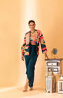 A Multi Color Embroidered Jacket Set Paired With Bustier And Drape Skirt