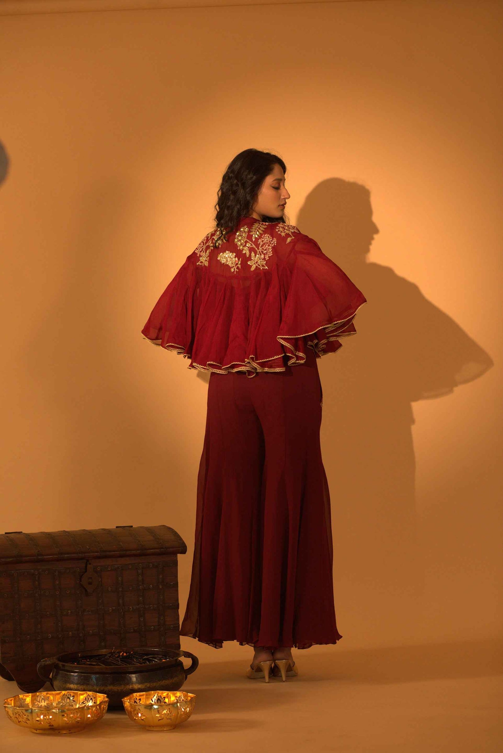 A Jumpsuit With Embroidered Cape