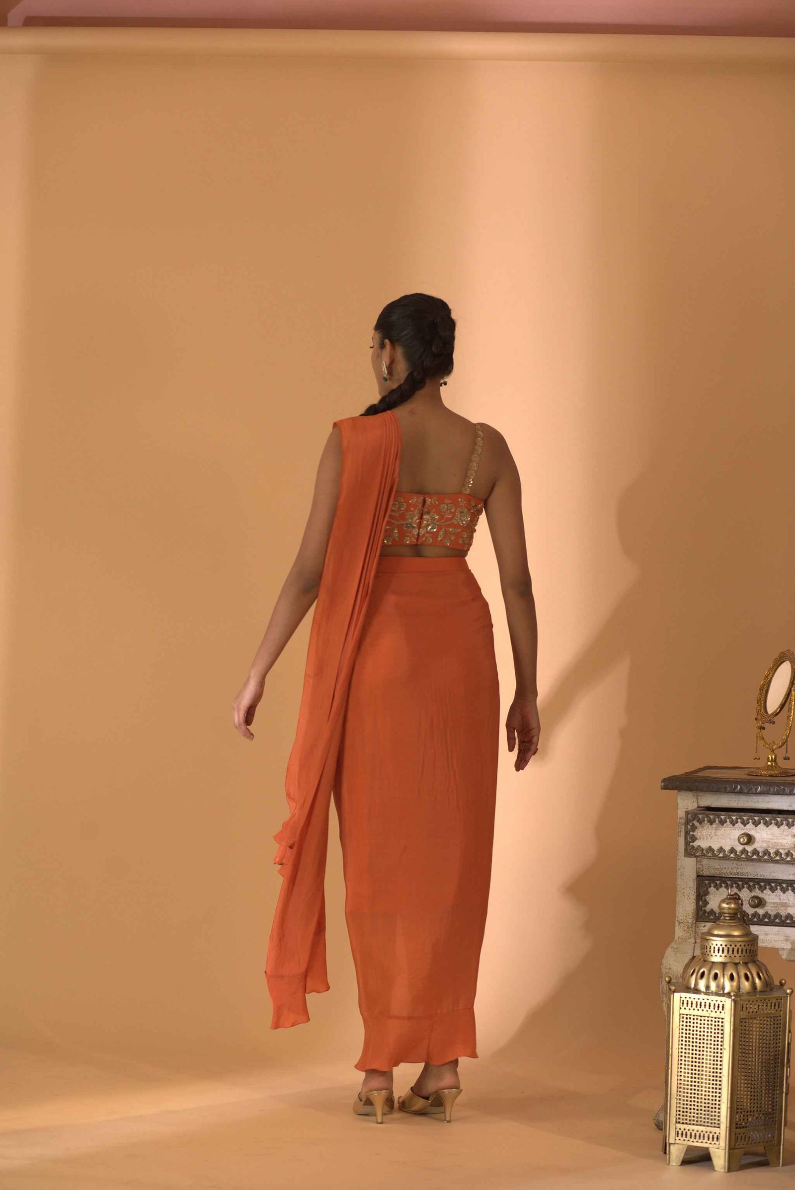 A Rust Pre-Draped Saree With Hand Embroidered Blouse
