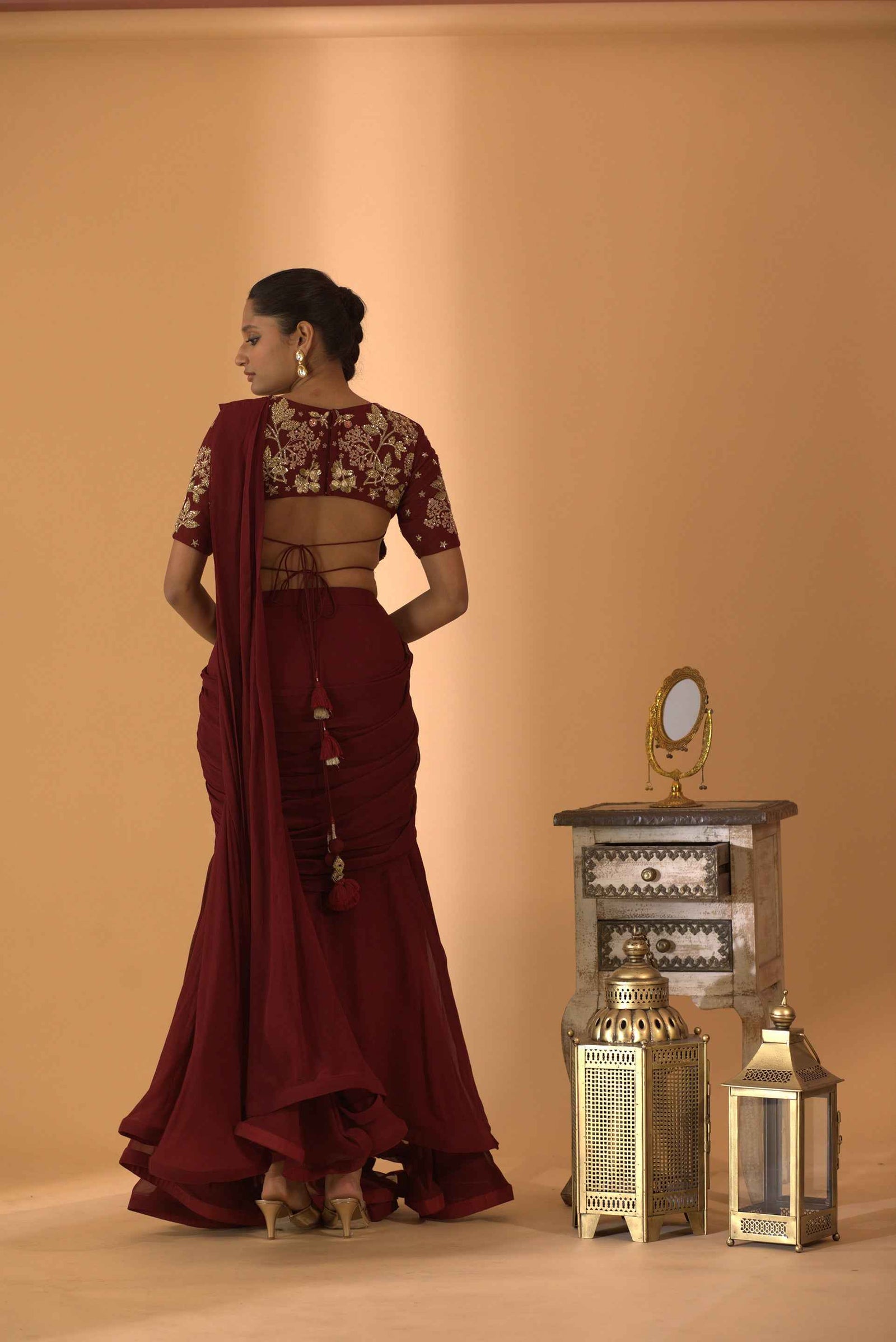 A Maroon Fish Cut Style Saree With Embroidered Blouse