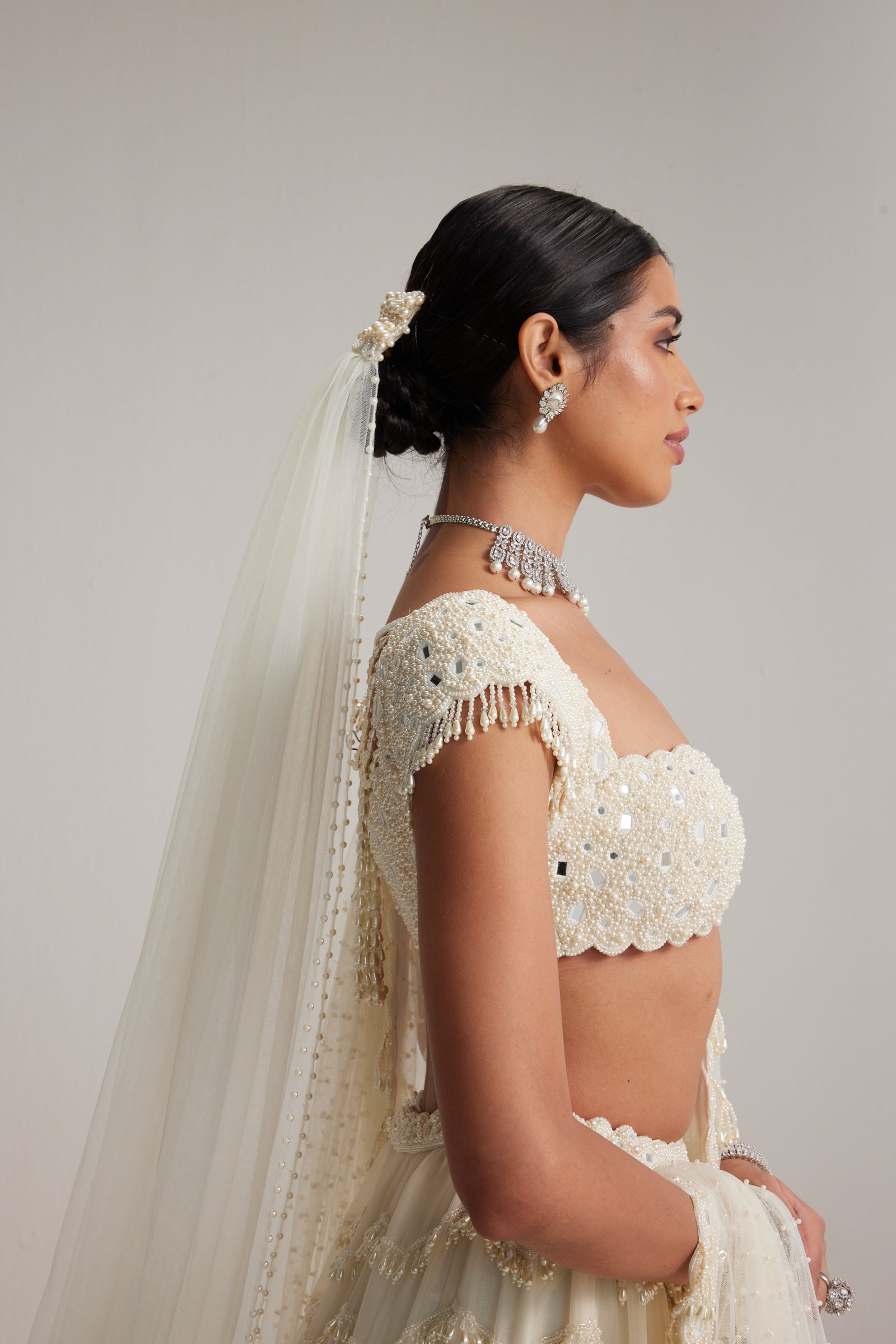 Off White Mirror and Pearl Drop Bridal lehenga set with Veil