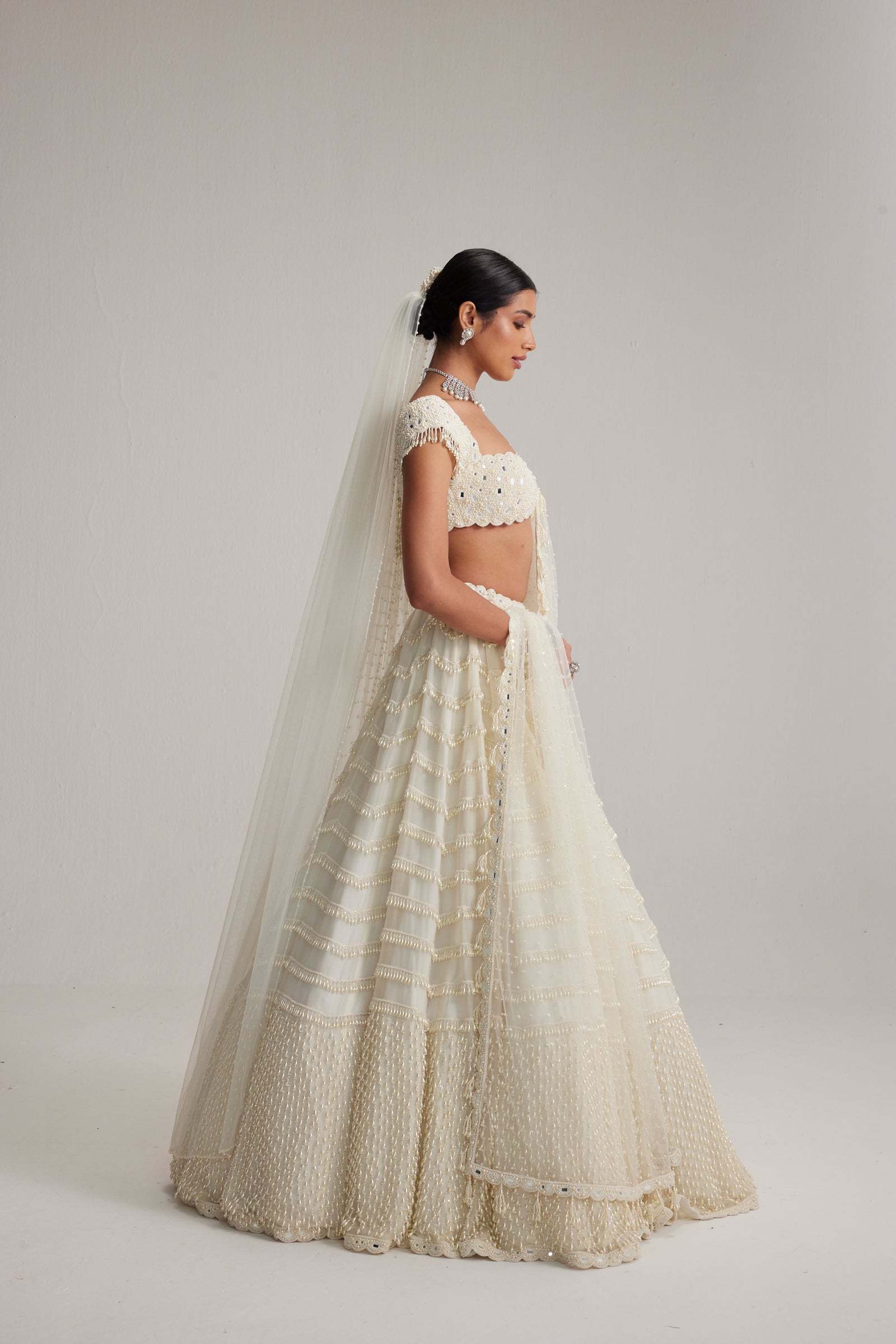 Off White Mirror and Pearl Drop Bridal lehenga set with Veil