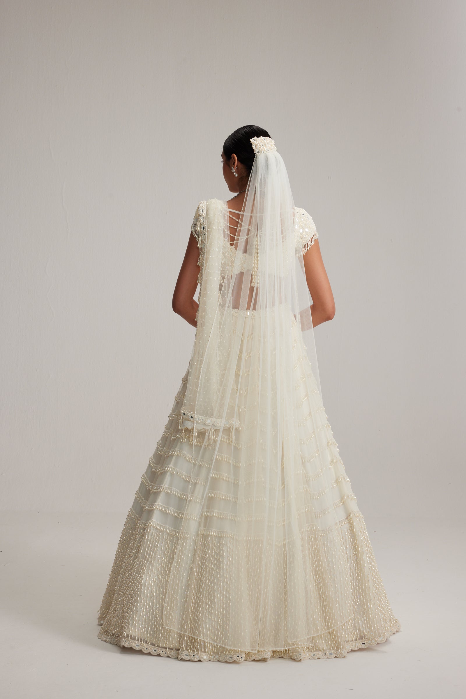 Off White Mirror and Pearl Drop Bridal lehenga set with Veil