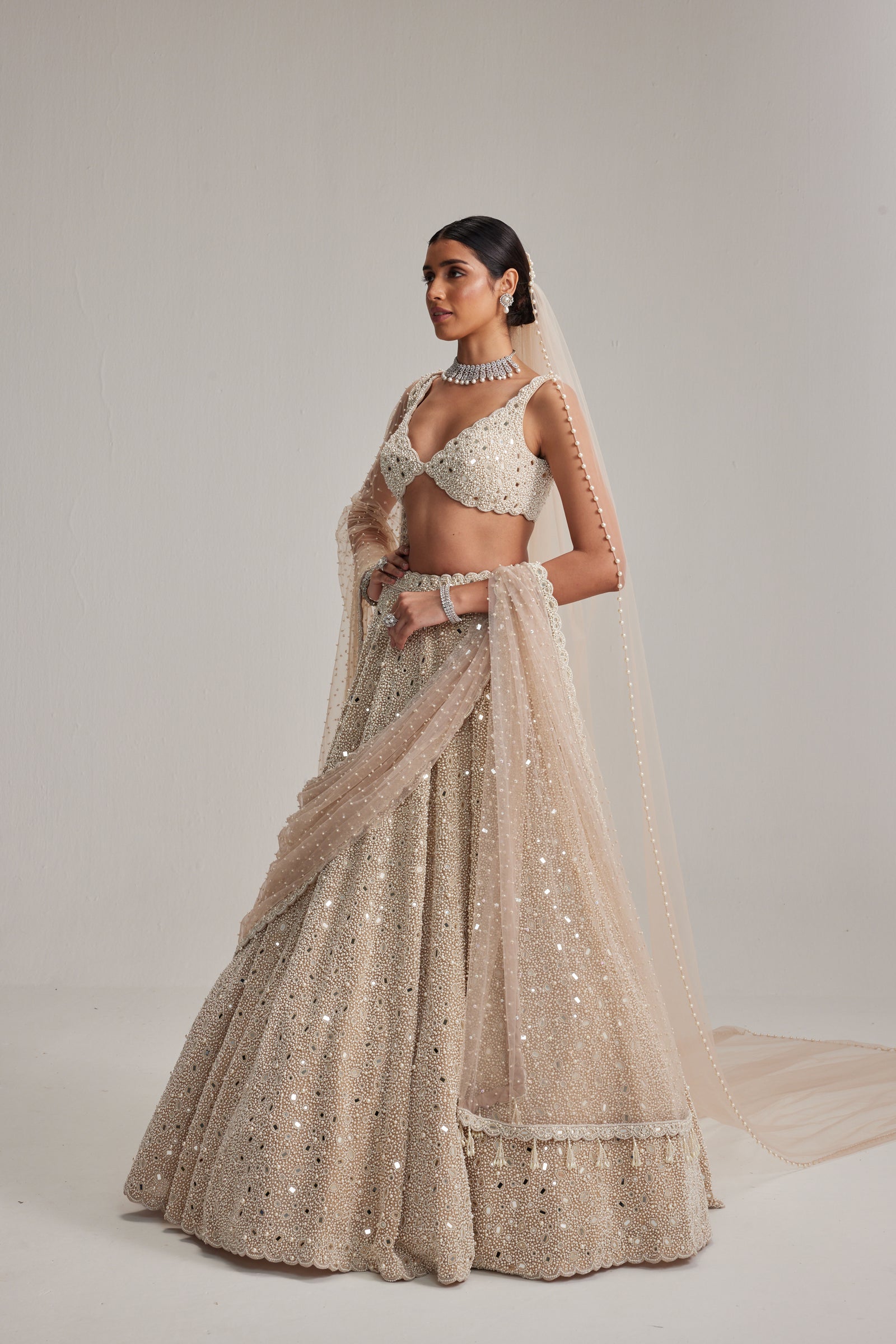 Light Beige Dense mirror and pearl lehenga set with Double Dupatta and Veil