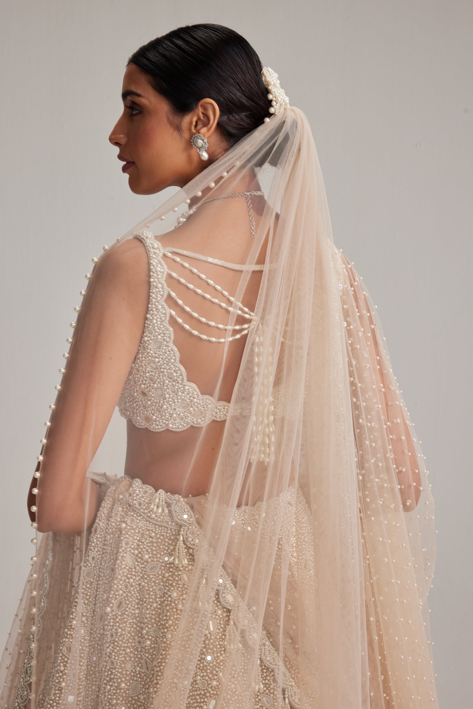 Light Beige Dense mirror and pearl lehenga set with Double Dupatta and Veil