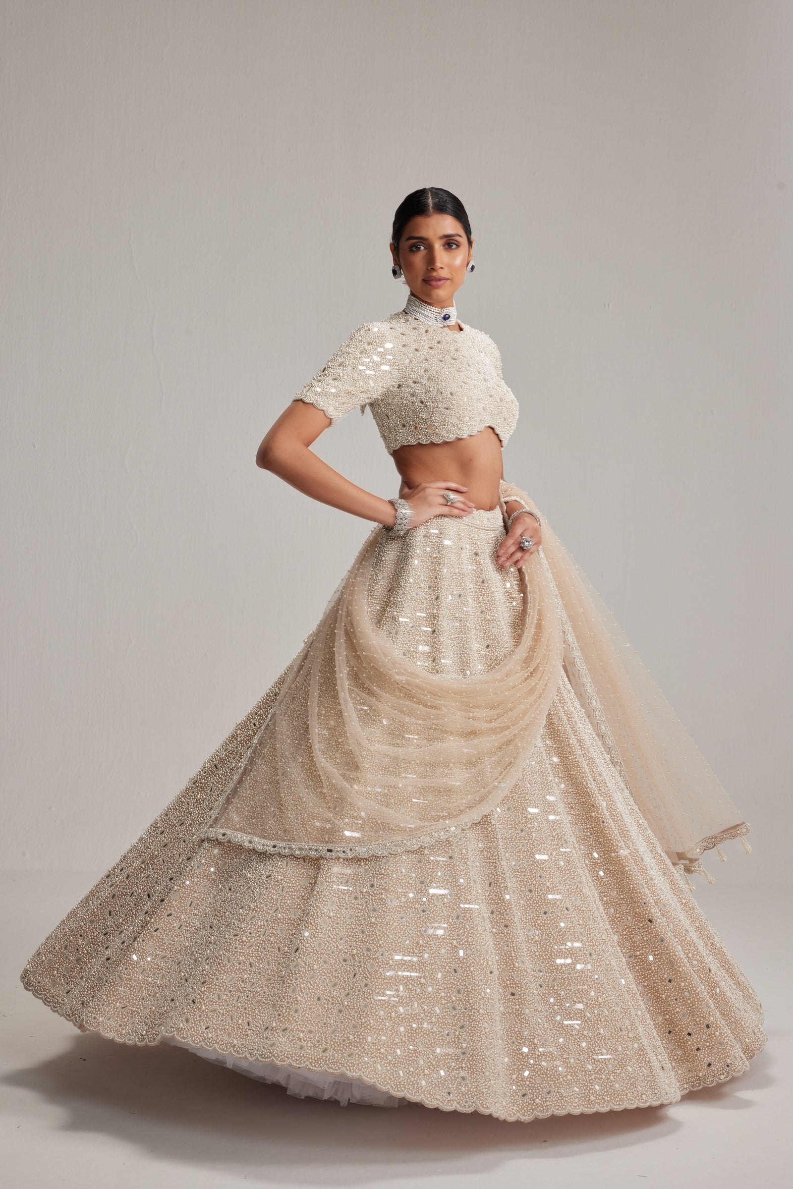 Light Beige Dense mirror and pearl lehenga set with High neck Blouse and Dupatta