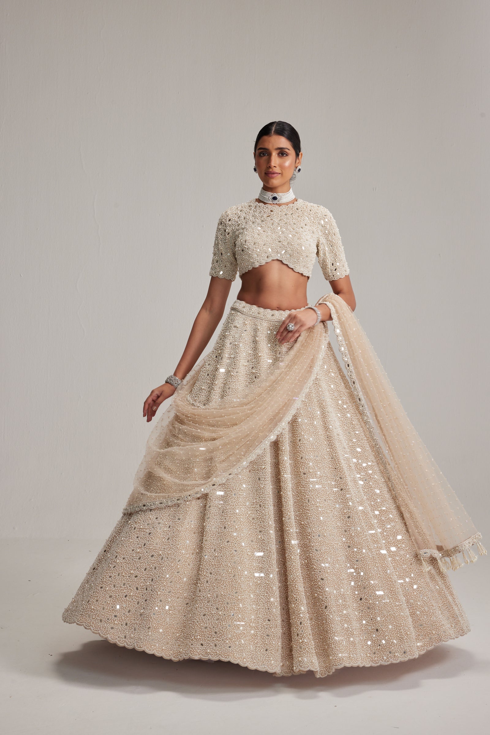 Light Beige Dense mirror and pearl lehenga set with High neck Blouse and Dupatta