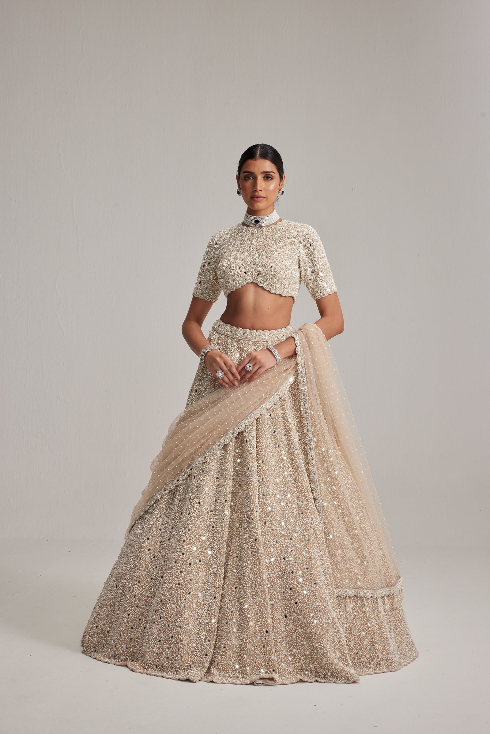 Light Beige Dense mirror and pearl lehenga set with High neck Blouse and Dupatta