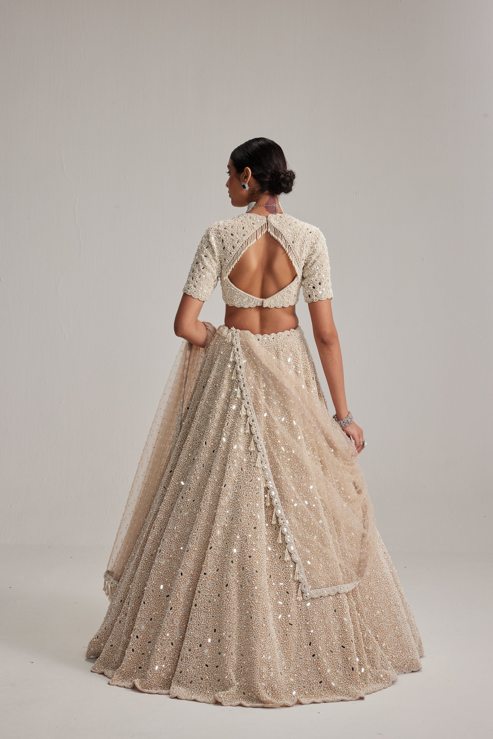 Light Beige Dense mirror and pearl lehenga set with High neck Blouse and Dupatta