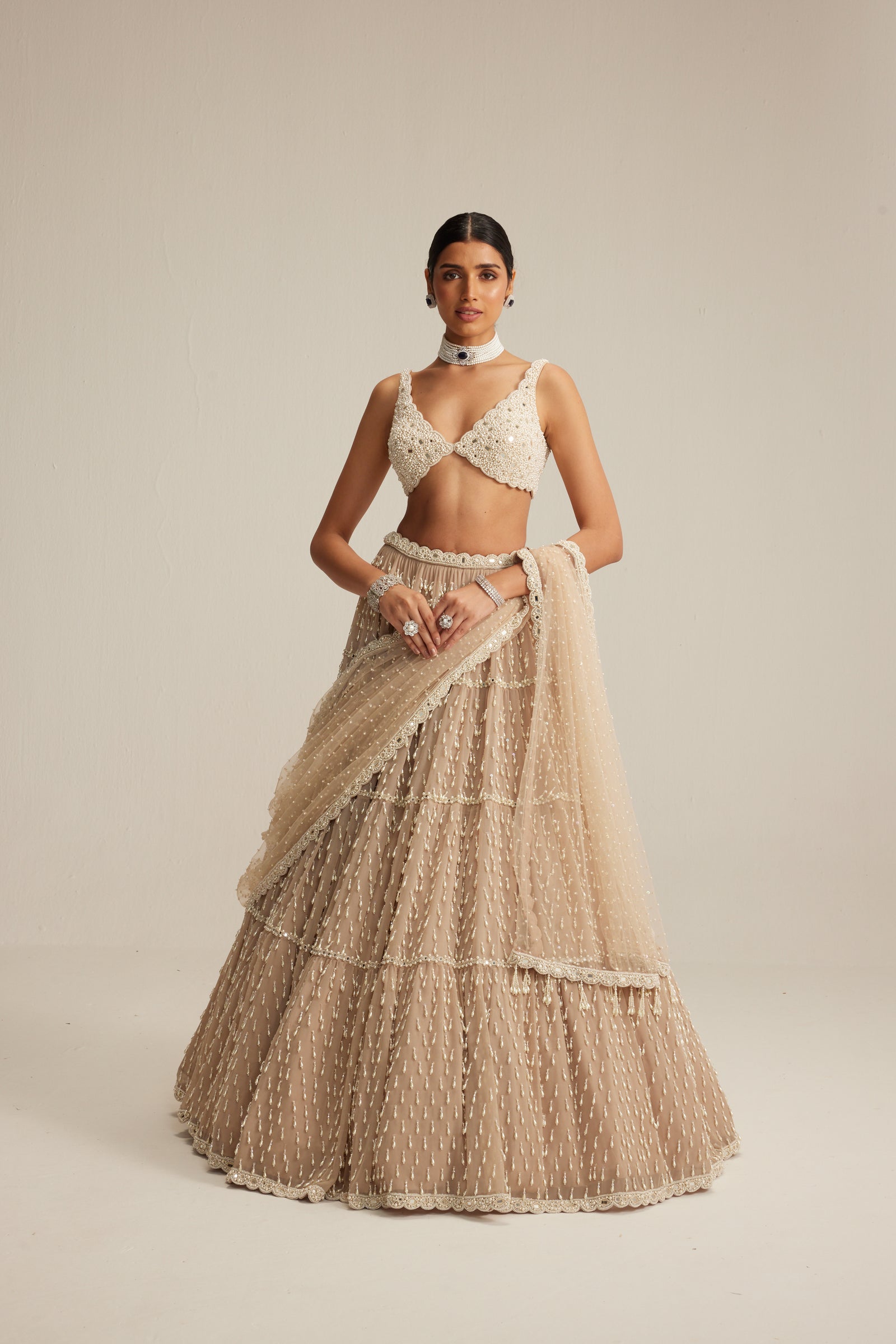 Light Beige Pearl Drop Multi Tier Lehenga Set.